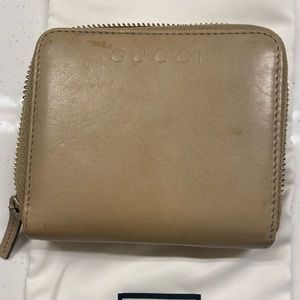 Gucci taupe leather wallet gently used in good condition.